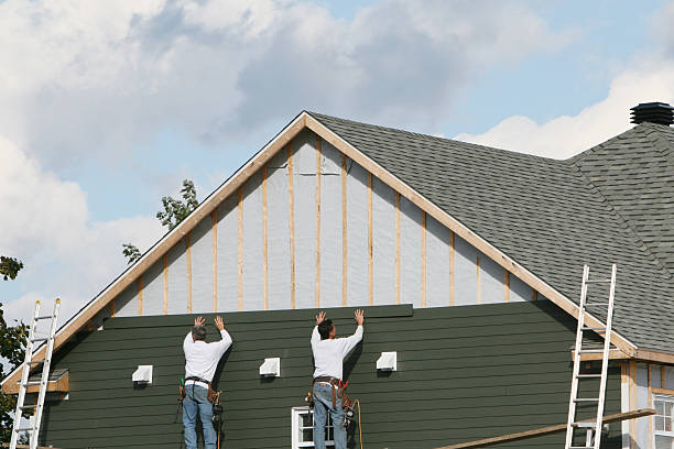 Professional Siding technician working in Slovan, PA